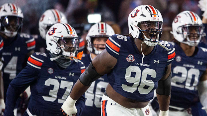 Auburn Tigers defensive lineman Philip Blidi (96) leads his team onto the field as Auburn Tigers take on Texas A&M Aggies at Jordan-Hare Stadium in Auburn, Ala., on Saturday, Sept. 7, 2024.