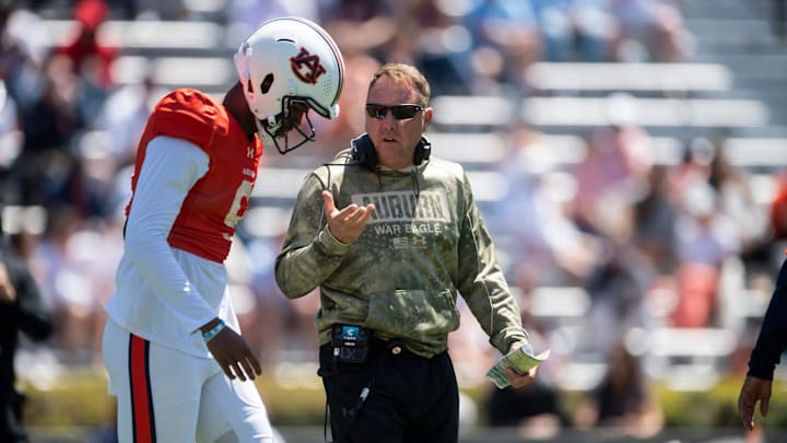 Auburn Tigers head coach Hugh Freeze talks with quarterback Deuce Knight (9) during Auburn Tigers A-Day football practice at Jordan-Hare Stadium in Auburn, Ala., on Saturday, April 12, 2025.