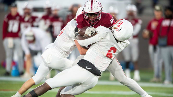 Maplesville's Nehemiah McCary (4) is taken down in the backfield by Wadley's Jaquez Wilkes (6) during the Class 1A football state championship at Protective Stadium in Birmingham, Ala., on Thursday, Dec. 5, 2024. Wadley defeated Maplesville 37-7.
