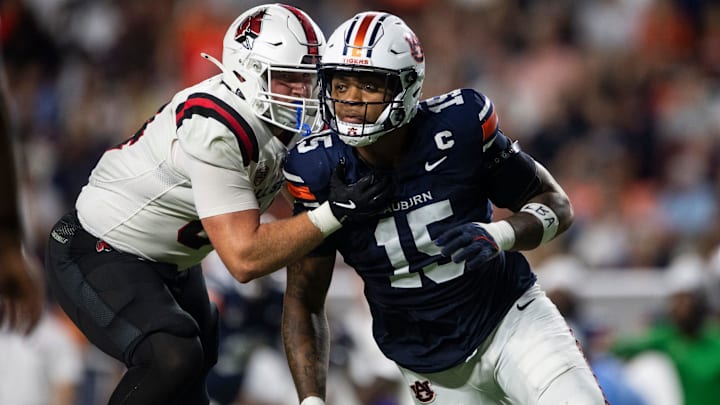 Auburn Tigers defensive end Keldric Faulk (15) blitzes as Auburn Tigers take on Ball State Cardinals at Jordan-Hare Stadium in Auburn, Ala. on Saturday, Sept. 6, 2025. Auburn Tigers defeated Ball State Cardinals 42-3.