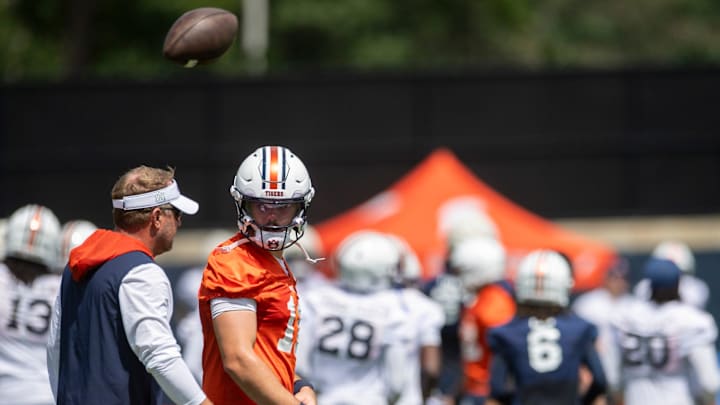 Auburn Tigers head coach Hugh Freeze talks with quarterback Jackson Arnold (11) during practice at Woltosz Football Performance Center in Auburn, Ala. on Thursday, Aug. 14, 2025.