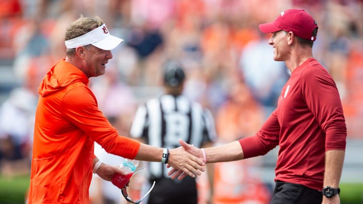 Auburn Tigers head coach Hugh Freeze and Oklahoma Sooners head coach Brent Venables shake hands during warm ups before Auburn Tigers take on Oklahoma Sooners at Jordan-Hare Stadium in Auburn, Ala., on Saturday, Sept. 28, 2024.