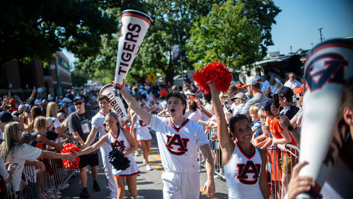 Auburn cheerleaders greet fans during Tiger Walk before Auburn Tigers take on South Alabama Jaguars at Jordan-Hare Stadium in Auburn, Ala. on Saturday, Sept. 13, 2025.