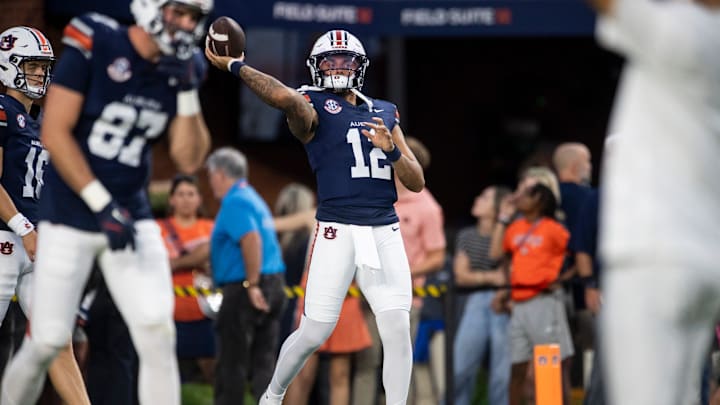 Auburn Tigers quarterback Ashton Daniels (12) warms up before Auburn Tigers take on Missouri Tigers at Jordan-Hare Stadium in Auburn, Ala. on Saturday, Oct. 18, 2025.