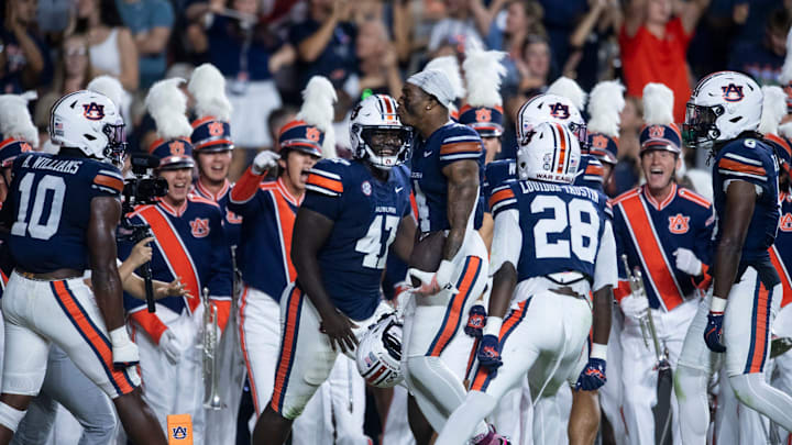 Auburn Tigers defensive back Kayin Lee (4) celebrates his interception as Auburn Tigers take on Missouri Tigers at Jordan-Hare Stadium in Auburn, Ala. on Saturday, Oct. 18, 2025. Missouri Tigers lead Auburn Tigers 10-7 at halftime.