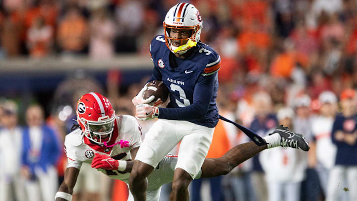 Auburn Tigers wide receiver Perry Thompson (3) spins off a defender as Auburn Tigers take on Georgia Bulldogs at Jordan-Hare Stadium in Auburn, Ala. on Saturday, Oct. 11, 2025. Georgia Bulldogs defeated Auburn Tigers 20-10.