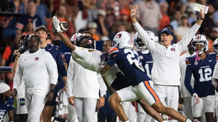 Auburn Tigers defensive back Jay Crawford (23) is called defensive pass interference on Missouri Tigers wide receiver Marquis Johnson (2) as Auburn Tigers defensive coordinator DJ Durkin. Auburn Tigers defensive back Jay Crawford (23) is called defensive pass interference on Missouri Tigers wide receiver Marquis Johnson (2) as Auburn Tigers defensive coordinator DJ Durkin.