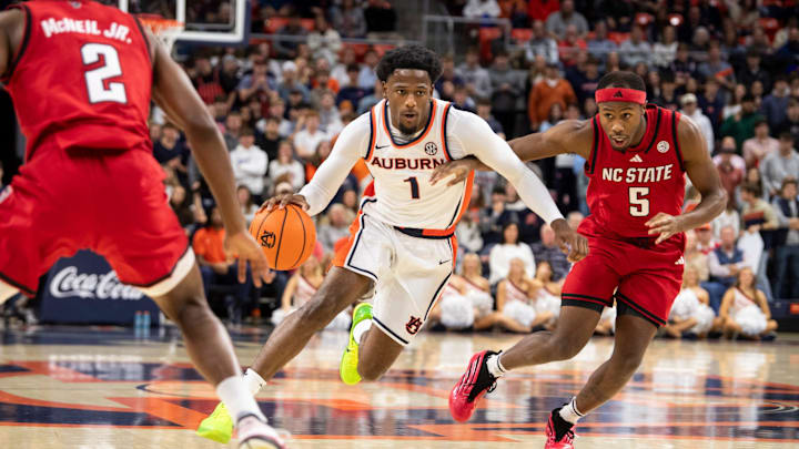 Auburn Tigers guard Kevin Overton (1) drives the ball as Auburn Tigers take on NC State Wolfpack at Neville Arena in Auburn, Ala. on Wednesday, Dec. 3, 2025.