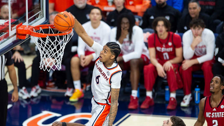 Auburn Tigers guard Elyjah Freeman (6) dunks the ball as Auburn Tigers take on NC State Wolfpack at Neville Arena in Auburn, Ala. on Wednesday, Dec. 3, 2025. Auburn Tigers lead NC State Wolfpack 41-35 at halftime.