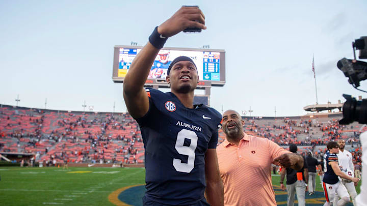 Auburn Tigers quarterback Deuce Knight (9) does a selfie video after the game as Auburn Tigers take on Mercer Bears at Jordan-Hare Stadium in Auburn, Ala. on Saturday, Nov. 22, 2025. Auburn Tigers defeated the Mercer Bears 62-17.