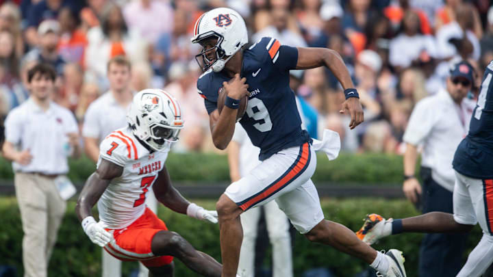 Auburn Tigers quarterback Deuce Knight (9) runs the ball into the end zone for a touchdown as Auburn Tigers take on Mercer Bears at Jordan-Hare Stadium in Auburn, Ala. on Saturday, Nov. 22, 2025. Auburn Tigers lead the Mercer Bears 35-17 at halftime.