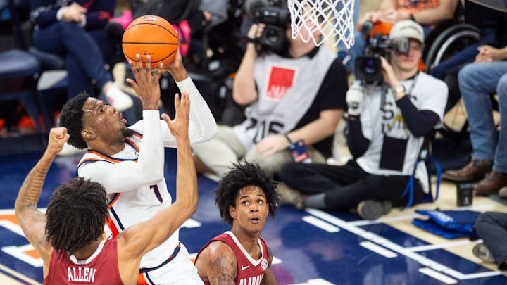 Auburn Tigers guard Kevin Overton (1) goes up for a layup as Auburn Tigers take on Alabama Crimson Tide at Neville Arena in Auburn, Ala. on Saturday, Feb. 7, 2026. Auburn Tigers lead Alabama Crimson Tide 41-37 at halftime.