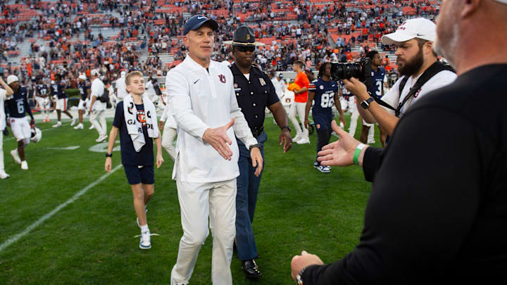 Auburn Tigers interim head coach DJ Durkin and Mercer Bears head coach Mike Jacobs shake hands after the game as Auburn Tigers take on Mercer Bears at Jordan-Hare Stadium in Auburn, Ala. on Saturday, Nov. 22, 2025. Auburn Tigers defeated the Mercer Bears 62-17.