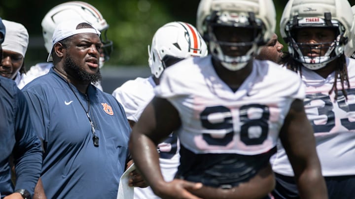 Auburn Tigers defensive tackles coach Vontrell King-Williams huddles with his team during practice at Woltosz Football Performance Center in Auburn, Ala. on Thursday, Aug. 14, 2025. Auburn Tigers defensive tackles coach Vontrell King-Williams huddles with his team during practice at Woltosz Football Performance Center in Auburn, Ala. on Thursday, Aug. 14, 2025.