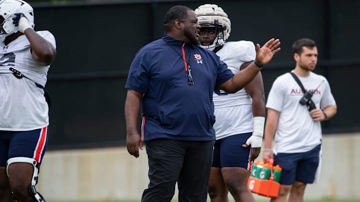 Auburn Tigers defensive tackles coach Vontrell King-Williams talks with players during practice at Woltosz Football Performance Center in Auburn, Ala., on Tuesday, April 2, 2024.