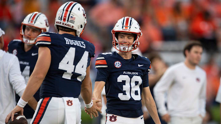 Auburn Tigers kicker Alex McPherson (38) high fives teammates during warm ups before Auburn Tigers take on Georgia Bulldogs at Jordan-Hare Stadium in Auburn, Ala. on Saturday, Oct. 11, 2025.
