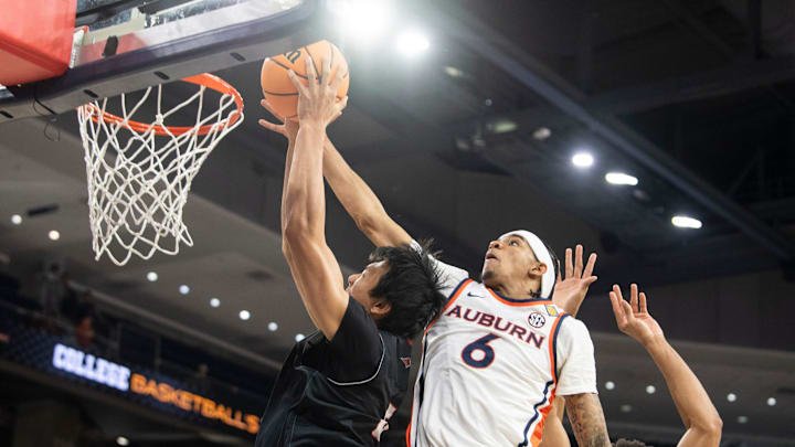Auburn Tigers guard Elyjah Freeman (6) blocks Seattle Redhawks center Houran Dan (6) as Auburn Tigers take on Seattle Redhawks during the second round of the National Invitation Tournament at Neville Arena in Auburn, Ala. on Sunday, March 22, 2026.