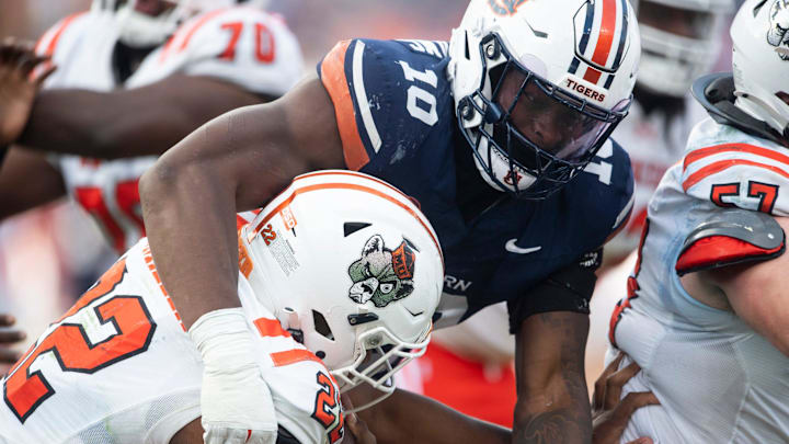Auburn Tigers defensive end Amaris Williams (10) tackles Mercer Bears running back CJ Miller (22) as Auburn Tigers take on Mercer Bears at Jordan-Hare Stadium in Auburn, Ala. on Saturday, Nov. 22, 2025. Auburn Tigers defeated the Mercer Bears 62-17. Auburn Tigers defensive end Amaris Williams (10) tackles Mercer Bears running back CJ Miller (22) as Auburn Tigers take on Mercer Bears at Jordan-Hare Stadium in Auburn, Ala. on Saturday, Nov. 22, 2025. Auburn Tigers defeated the Mercer Bears 62-17.