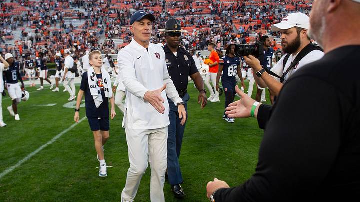 Auburn Tigers interim head coach DJ Durkin and Mercer Bears head coach Mike Jacobs shake hands after the game as Auburn Tigers take on Mercer Bears at Jordan-Hare Stadium in Auburn, Ala. on Saturday, Nov. 22, 2025. Auburn Tigers defeated the Mercer Bears 62-17. Auburn Tigers interim head coach DJ Durkin and Mercer Bears head coach Mike Jacobs shake hands after the game as Auburn Tigers take on Mercer Bears at Jordan-Hare Stadium in Auburn, Ala. on Saturday, Nov. 22, 2025. Auburn Tigers defeated the Mercer Bears 62-17.