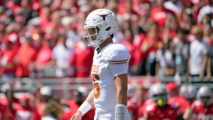 Texas Longhorns quarterback Arch Manning (16) walks back the team huddle against Ohio State Buckeyes in the first quarter of their game at Ohio Stadium in Columbus, Ohio on Aug 30, 2025.