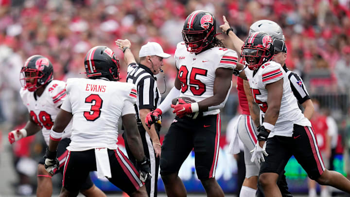 Sep 16, 2023; Columbus, Ohio, USA; Western Kentucky Hilltoppers defensive end Deante McCray (95) celebrates after recovering Ohio State Buckeyes quarterback Kyle McCord (6) fumble during the first quarter of their game at Ohio Stadium.