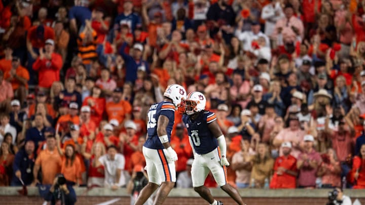 Auburn Tigers linebacker Robert Woodyard Jr. (0) celebrates his sack with defensive end Keldric Faulk (15) as Auburn Tigers take on Georgia Bulldogs at Jordan-Hare Stadium in Auburn, Ala. on Saturday, Oct. 11, 2025. Georgia Bulldogs defeated Auburn Tigers 20-10. Auburn Tigers linebacker Robert Woodyard Jr. (0) celebrates his sack with defensive end Keldric Faulk (15) as Auburn Tigers take on Georgia Bulldogs at Jordan-Hare Stadium in Auburn, Ala. on Saturday, Oct. 11, 2025. Georgia Bulldogs defeated Auburn Tigers 20-10.