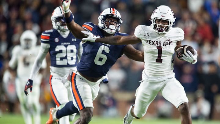 Texas A&M Aggies wide receiver Jabre Barber (1) is tackled by Auburn Tigers linebacker Austin Keys (6) as Auburn Tigers take on Texas A&M Aggies at Jordan-Hare Stadium in Auburn, Ala., on Saturday, Sept. 7, 2024. Auburn Tigers defeated Texas A&M Aggies 43-41 in fourth overtime.