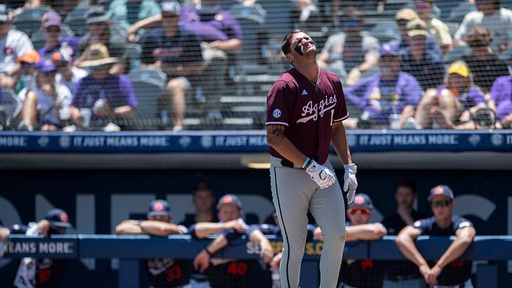 Texas A&M Aggies' Jace LaViolette (17) strains after getting hit in the hand by a pitch as Auburn Tigers take on Texas A&M Aggies during the SEC baseball tournament at Hoover Met in Birmingham, Ala., on Thursday, May 22, 2025.