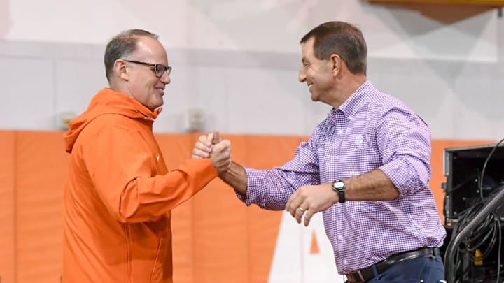 Clemson defensive coordinator Tom Allen greets head coach Dabo Swinney on the way to speaking during the Clemson Club football National Signing Day wrap up presented by Clemson Seneca Chick-Fil-A at the Poe Indoor Practice Facility at Clemson University in Clemson, S.C. Feb 5, 2025.