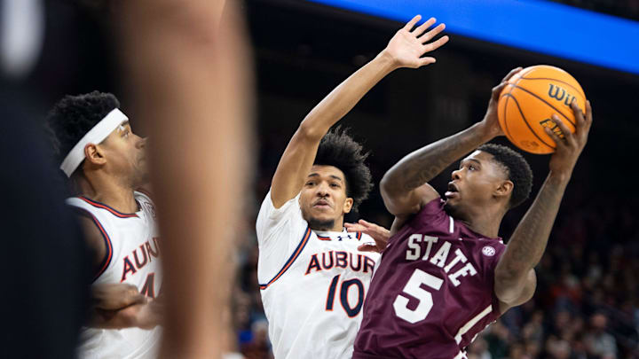 Mississippi State Bulldogs guard Shawn Jones Jr. (5) goes up for a layup on Auburn Tigers forward Chad Baker-Mazara (10) as Auburn Tigers take on Mississippi State Bulldogs at Neville Arena in Auburn, Ala., on Tuesday, Jan. 14, 2025. Auburn Tigers lead Mississippi State Bulldogs 46-27 at halftime.