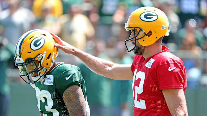 Green Bay Packers quarterback Aaron Rodgers (12) gives cornerback Jaire Alexander (23) and encouraging pat on the helmet during Green Bay Packers Training Camp Saturday, July 28, 2018 at Ray Nitschke Field in Ashwaubenon, Wis

Packers 2018 04