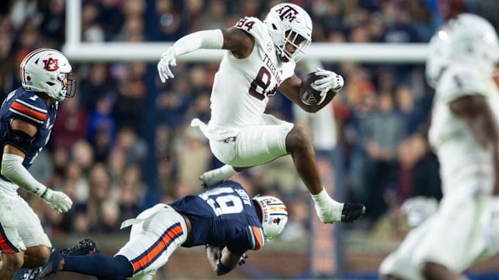 Texas A&M Aggies tight end Tre Watson (84) attempt to hurdle Auburn Tigers safety Sylvester Smith (19) as Auburn Tigers take on Texas A&M Aggies at Jordan-Hare Stadium in Auburn, Ala., on Saturday, Sept. 7, 2024. Auburn Tigers defeated Texas A&M Aggies 43-41 in fourth overtime. Texas A&M Aggies tight end Tre Watson (84) attempt to hurdle Auburn Tigers safety Sylvester Smith (19) as Auburn Tigers take on Texas A&M Aggies at Jordan-Hare Stadium in Auburn, Ala., on Saturday, Sept. 7, 2024. Auburn Tigers defeated Texas A&M Aggies 43-41 in fourth overtime.