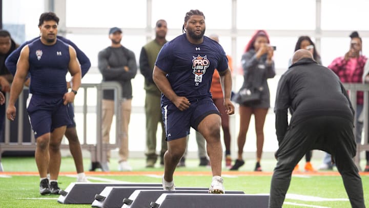 Auburn Tigers defensive lineman Justin Rogers (52) runs drills during Auburn Football Pro Day at the Woltosz Football Performance Center in Auburn, Ala., on Friday, March 22, 2024.