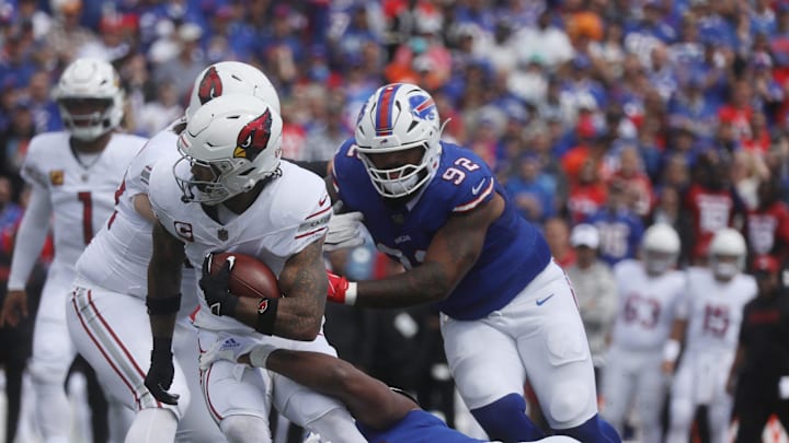 Arizona's James Conner carries the ball before getting taken down by Bills defensive end Greg Rousseau during first half action at Highmark Stadium in Orchard Park on Sept. 8, 2024. Arizona's James Conner carries the ball before getting taken down by Bills defensive end Greg Rousseau during first half action at Highmark Stadium in Orchard Park on Sept. 8, 2024.