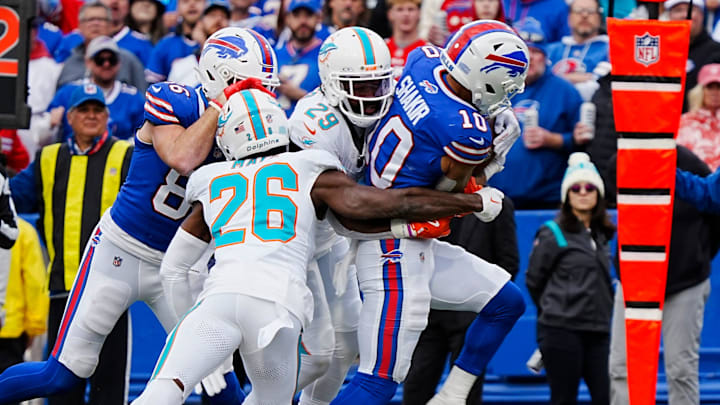 Bills WR Khalil Shakir drags Miami's Kendall Fuller a few yards after making the catch during second half action at Highmark Stadium in Orchard Park on Nov. 3, 2024. Joining Fuller on the tackle is Marcus Maye.