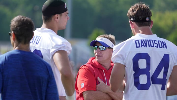 Buffalo Bills special teams coordinator, Chris Tabor, talks with tight ends Buffalo Bills tight end Keleki Latu and tight end Zach Davidson before practice at the Buffalo Bills training camp. Buffalo Bills special teams coordinator, Chris Tabor, talks with tight ends Buffalo Bills tight end Keleki Latu and tight end Zach Davidson before practice at the Buffalo Bills training camp.