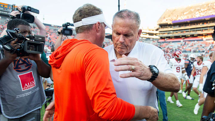 Auburn Tigers head coach Hugh Freeze and Arkansas Razorbacks head coach Sam Pittman hug after the game as Auburn Tigers take on Arkansas Razorbacks at Jordan-Hare Stadium in Auburn, Ala., on Saturday, Sept. 21, 2024. Arkansas Razorbacks defeated Auburn Tigers 24-14.