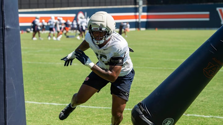 Auburn Tigers defensive end Keldric Faulk (15) runs through drills during practice at Woltosz Football Performance Center in Auburn, Ala. on Tuesday, Aug. 19, 2025.