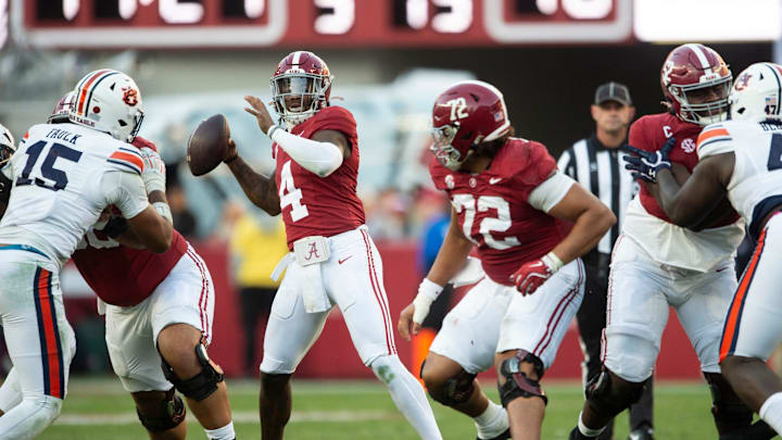 Alabama Crimson Tide quarterback Jalen Milroe (4) throws the ball as Auburn Tigers take on Alabama Crimson Tide at Bryant-Denny Stadium in Tuscaloosa, Ala., on Saturday, Nov. 30, 2024. Alabama Crimson Tide defeated Auburn Tigers 28-14.