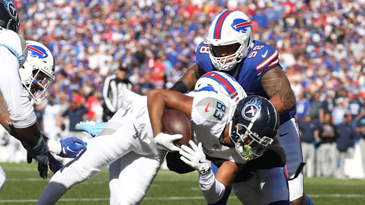 Bills Terrel Bernard wraps up Titans Tyler Boyd during first half action at Highmark Stadium in Orchard Park
