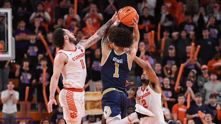 Clemson guard Jaeden Zachery (11) defends Georgia Tech guard Naithan George (1) during the third overtime at Littlejohn Coliseum in Clemson, S.C. Tuesday, February 4, 2025. Clemson guard Jaeden Zachery (11) defends Georgia Tech guard Naithan George (1) during the third overtime at Littlejohn Coliseum in Clemson, S.C. Tuesday, February 4, 2025.