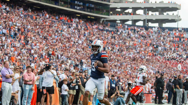 Auburn Tigers quarterback Deuce Knight (9) runs into the end zone for his second touchdown as Auburn Tigers take on Mercer Bears at Jordan-Hare Stadium in Auburn, Ala. on Saturday, Nov. 22, 2025.