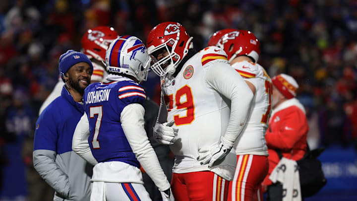 Bills cornerback Taron Johnson and Chiefs left tackle Donovan Smith have a laugh during a t.v. timeout in the second half of the Bills divisional game against Kansas City Chiefs at Highmark Stadium in Orchard Park on Jan. 21, 2024.