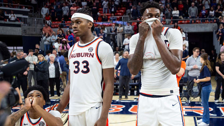 Auburn Tigers players watch the replay of a possible game winning shot that was called back against Texas A&M