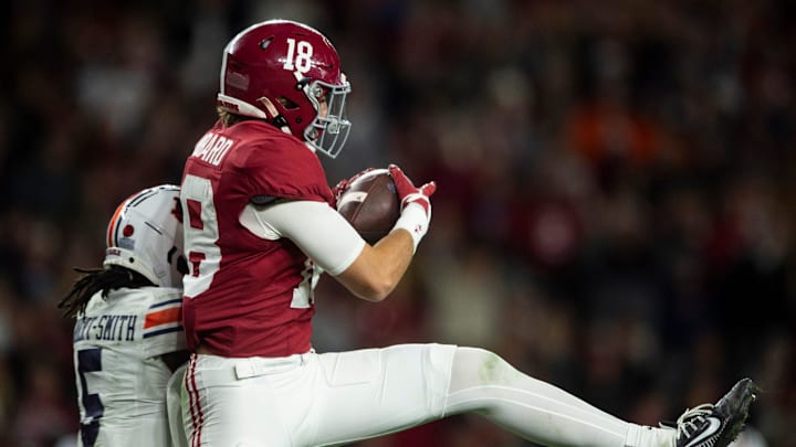 Alabama Crimson Tide defensive back Bray Hubbard (18) intercepts a pass intended for Auburn Tigers wide receiver KeAndre Lambert-Smith (5) as Auburn Tigers take on Alabama Crimson Tide at Bryant-Denny Stadium in Tuscaloosa, Ala., on Saturday, Nov. 30, 2024. Alabama Crimson Tide defeated Auburn Tigers 28-14.