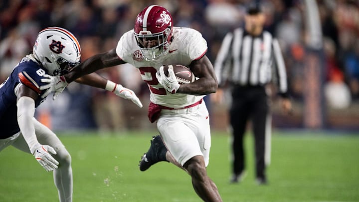 Alabama Crimson Tide running back Jam Miller (26) runs the ball as Auburn Tigers take on Alabama Crimson Tide in the Iron Bowl at Jordan-Hare Stadium in Auburn, Ala. on Saturday, Nov. 29, 2025. Alabama Crimson Tide leads Auburn Tigers 17-6.