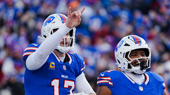 Buffalo Bills quarterback Josh Allen (17) signals they are going for the two point conversion during the second half of the Buffalo Bills wild card game against the Denver Broncos