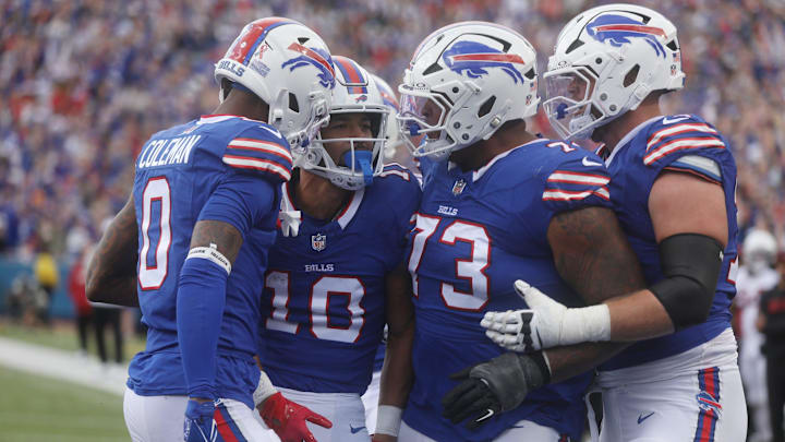 Bills' Khalil Shakir is congratulated by teammates Keon Coleman, Dion Dawkins, and Spencer Brown on his touchdown catch. Bills' Khalil Shakir is congratulated by teammates Keon Coleman, Dion Dawkins, and Spencer Brown on his touchdown catch.
