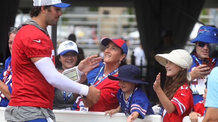 Bills Quarterback Josh Allen gives high-fives to fans as he circles the stadium at the end of Bills training camp at St. John Fisher University in Pittsford, NY on August 8, 2024. Today was the last day at St. John Fisher.
