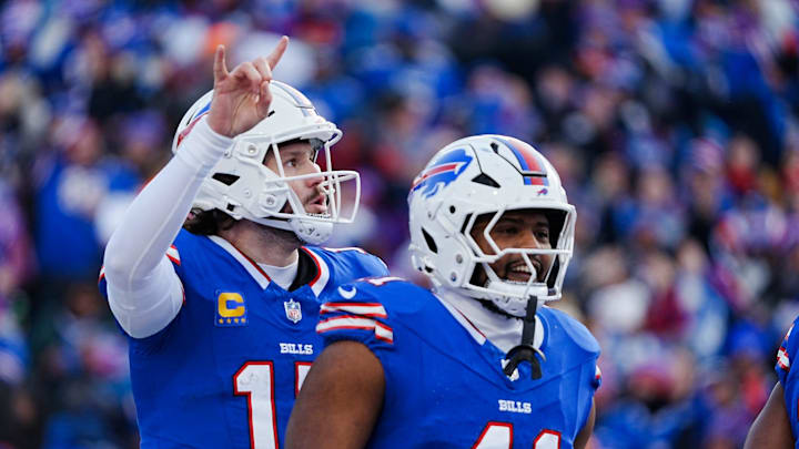 Buffalo Bills quarterback Josh Allen signals they are going for the two-point conversion during the second half of the Buffalo Bills wild card game against the Denver Broncos at Highmark Stadium in Orchard Park on Jan. 12, 2025. Smiling about the touchdown is Buffalo Bills fullback Reggie Gilliam.